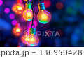 Color-changing LED bulbs pulsing rhythmically against a vibrant backdrop at a festive gathering 136950428