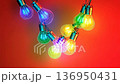 Color-changing LED bulbs pulsing rhythmically against a vibrant backdrop at a festive gathering 136950431