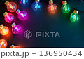 Color-changing LED bulbs pulsing rhythmically against a vibrant backdrop at a festive gathering 136950434