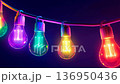 Color-changing LED bulbs pulsing rhythmically against a vibrant backdrop at a festive gathering 136950436