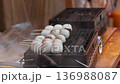 Vendor Grilling Dango Skewers at Japanese Street Food Stall 136988087