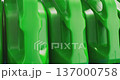 Green plastic motor oil canisters on a shelf 137000758