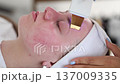 Female at cosmetic beauty spa clinic has facial hardware cosmetology. Woman making beauty procedures 137009335