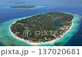 Aerial view of Gili Meno island, Indonesia, with Gili Air and Lombok visible in the background. Scenic tropical seascape with turquoise water and coral reefs. 137020681