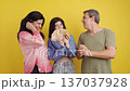 Happy family celebrating with cash money on yellow background 137037928