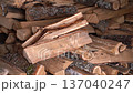 Wooden firewood is stacked together with other firewood 137040247