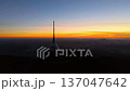 Jested Mountain shows a sunset over Czechia. The transmitter stands tall while the sky changes colors. Viewers can enjoy this beautiful moment from the height of the mountain. 137047642