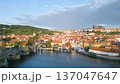 Discover the beauty of Charles Bridge and Prague Castle during a serene morning. The stunning views of the Vltava River complement the historic architecture of this charming city. 137047647