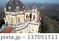 Close up aerial shot of the grand dome and ornate bell tower of the Basilica of Superga in Turin, Italy, historic baroque architecture, hilltop landmark panorama, sunny daylight. 137051511