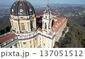 High angle drone shot shows the majestic Basilica of Superga with its grand dome and classical portico on the hilltop in Turin, Italy, historic baroque architecture, city panorama, sunny daylight. 137051512