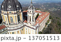 Aerial drone shot shows the majestic Basilica of Superga with its grand dome and monastery buildings on the hilltop in Turin, Italy, baroque architecture, urban panorama, sunny daylight scene. 137051513