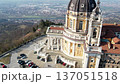 High angle drone shot shows the majestic Basilica of Superga with its grand dome and classical portico on the hilltop in Turin, Italy, historic baroque architecture, city panorama, sunny daylight. 137051518