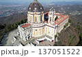 Aerial drone view of the majestic Basilica of Superga with its grand dome and bell tower in Turin, Italy, baroque architecture, hilltop landmark, urban panorama, sunny daylight. 137051522