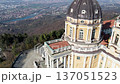 Aerial drone view of the majestic Basilica of Superga with its grand dome on the hilltop in Turin, Italy, historic baroque architecture, river Po valley panorama, sunny daylight. 137051523