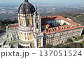 Aerial drone view of the majestic Basilica of Superga and its monastery buildings on the hilltop in Turin, Italy, historic baroque architecture, city panorama, sunny daylight. 137051524