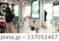 busy mall cafe featuring bright food ordering terminals 137052467