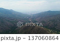 Mountain landscape opening to city view, Drone footage from rural hills to modern cityscape, Aerial perspective showing nature and urban contrast Yumbo, Valle del Cauca, Colombia 137060864