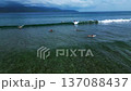 surfer surfing on waves, Gili Trawangan island. Unique aerial view Perfect aerial view drone 137088437
