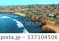 Drone shot of Del Mar city with coastal cliffs, sandy beach and Pacific Ocean waves along shoreline 137104506