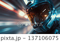 Close-up of a racer wearing a futuristic helmet speeding through a tunnel with blurred lights. 137106075