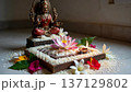 Tranquil altar scene featuring a goddess statue and floral offerings. 137129802