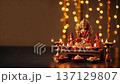 Beautifully arranged altar for Diwali celebration with lights and offerings. 137129807