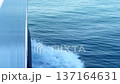 Close-up of a Ship Cutting Through Ocean Waves Creating White Foam 137164631