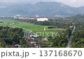View from sky drone view over Balik Pulau rice fields, village, road and distant mountains. 137168670