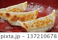 Delicious looking roasted dumplings 137210678