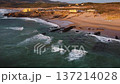 stunning highangle shot capturing seaside home amidst wild ocean waves and rocky formations 137214028