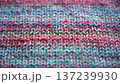 Close-up Texture of Handmade Knitted Clothing with Colorful Yarn Patterns 137239930