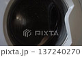 Clothes Spinning in a Washing Machine Drum During a Wash Cycle 137240270