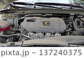 Car engine revving under open hood 137240375