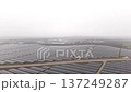 Aerial Perspective Highlighting Foggy Solar Installations On Flat Agricultural Landscape With 137249287