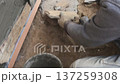 A builder faces the basement of a house with a wild stone. Flat for cladding, tabata on the construction site. 137259308
