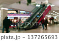 people walking through a modern shopping mall 137265693