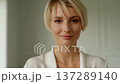 Bright Minimalist Interior Featuring Woman. Professional Woman With Soft Expression In Wellness Setting 137289140