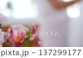 Romantic married couple dancing at home near the window against a background of flowers 137299177