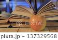 Apple and open books on wooden table, education concept 137329568