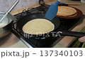 Flipping a Crepe on a Gas Stove 137340103