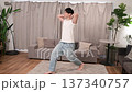 Japanese man doing lunges at home 137340757