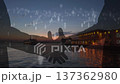Sunset Waterfront Silhouetted Handshake With Floating People Icons And Warm Pier Lights, Reflective Water 137362980