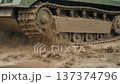 Military Tank Tracks Churning Thick Mud Close Up 137374796