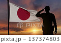 Soldier Saluting Waving Japan Flag Sunset Camera Pull Back 137374803