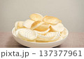 crab chips Rice shrimp chips in a wooden bowl on a blue background. Close-up footage on the rotating table. 137377961