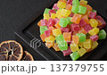 Candied fruit in colorful cubes as an ingredient for baked goods and sweets. Candied fruit 137379755