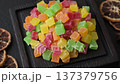 Candied fruit in colorful cubes as an ingredient for baked goods and sweets. Candied fruit 137379756