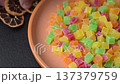 Candied fruit in colorful cubes as an ingredient for baked goods and sweets. Candied fruit 137379759