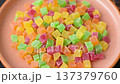 Candied fruit in colorful cubes as an ingredient for baked goods and sweets. Candied fruit 137379760