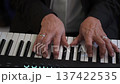 Elderly Hands On Synthesizer, Closeup Of Seasoned Hands Creating Emotional Melodies On Synthesizer 137422535